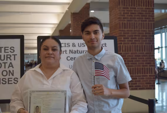 Photo of mother and son at naturalization ceremony