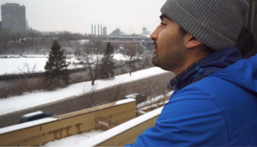 Jose looking out at university of minnesota campus in the winter