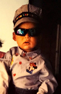 toddler José in hat and sunglasses