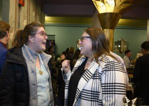 two people speaking excitedly to one another 